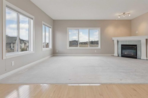 357 Kincora Drive Nw, Calgary, AB - Indoor Photo Showing Living Room With Fireplace
