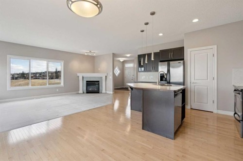 357 Kincora Drive Nw, Calgary, AB - Indoor Photo Showing Kitchen With Fireplace