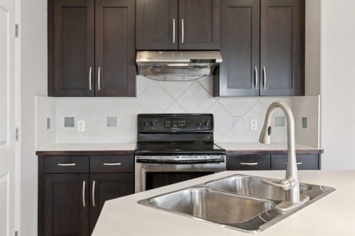 357 Kincora Drive Nw, Calgary, AB - Indoor Photo Showing Kitchen With Double Sink