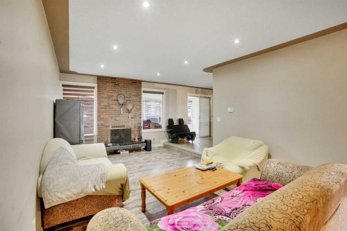 528 Whiteridge Way Ne, Calgary, AB - Indoor Photo Showing Living Room With Fireplace