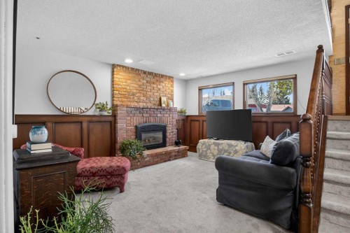 428 Ranch Estates Place Nw, Calgary, AB - Indoor Photo Showing Living Room With Fireplace