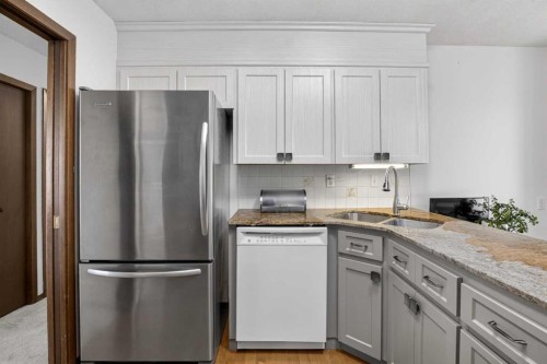 428 Ranch Estates Place Nw, Calgary, AB - Indoor Photo Showing Kitchen With Double Sink