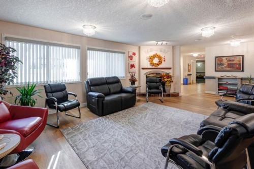 1114-1818 Simcoe Boulevard Sw, Calgary, AB - Indoor Photo Showing Living Room