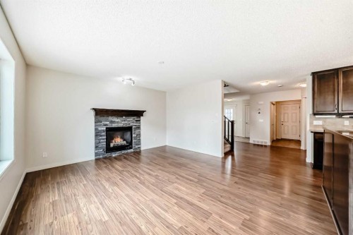 455 Cimarron Boulevard, Okotoks, AB - Indoor Photo Showing Living Room With Fireplace