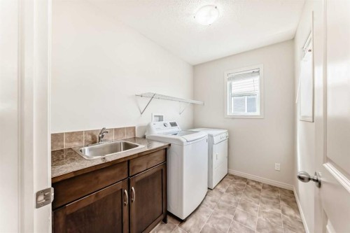 455 Cimarron Boulevard, Okotoks, AB - Indoor Photo Showing Laundry Room