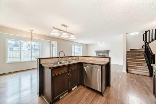 455 Cimarron Boulevard, Okotoks, AB - Indoor Photo Showing Kitchen With Double Sink