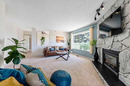 59 Strathcona Close Sw, Calgary, AB - Indoor Photo Showing Living Room With Fireplace
