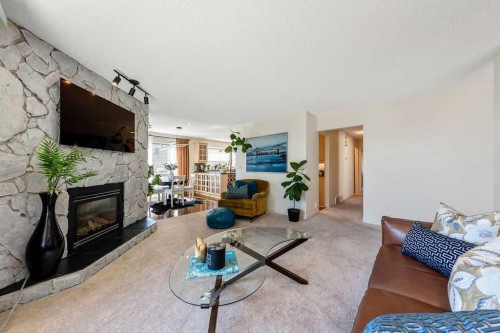 59 Strathcona Close Sw, Calgary, AB - Indoor Photo Showing Living Room With Fireplace