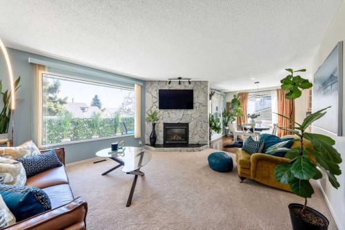 59 Strathcona Close Sw, Calgary, AB - Indoor Photo Showing Living Room With Fireplace
