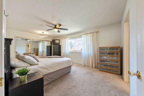 59 Strathcona Close Sw, Calgary, AB - Indoor Photo Showing Bedroom