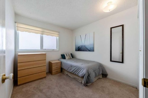 59 Strathcona Close Sw, Calgary, AB - Indoor Photo Showing Bedroom