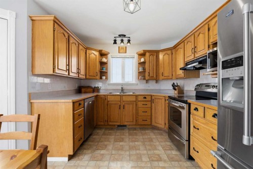 30 Arbour Ridge Circle Nw, Calgary, AB - Indoor Photo Showing Kitchen With Double Sink
