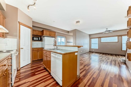 89 Hidden Ranch Hill Nw, Calgary, AB - Indoor Photo Showing Kitchen With Double Sink