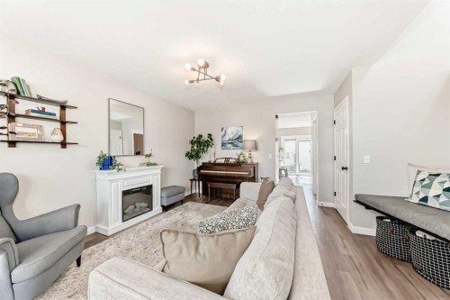 136 Hidden Hills Road Nw, Calgary, AB - Indoor Photo Showing Living Room With Fireplace