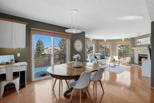 131 Edgebrook Circle Nw, Calgary, AB - Indoor Photo Showing Dining Room With Fireplace