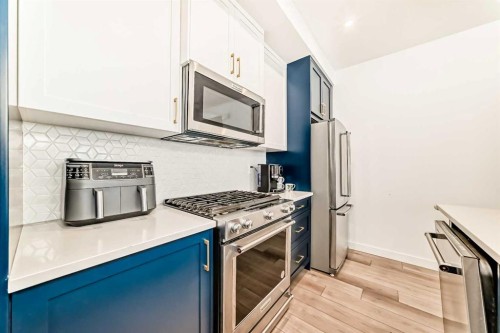 44 Spring Creek Common Sw, Calgary, AB - Indoor Photo Showing Kitchen With Stainless Steel Kitchen