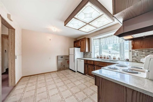 165 Marbrooke Circle Ne, Calgary, AB - Indoor Photo Showing Kitchen With Double Sink