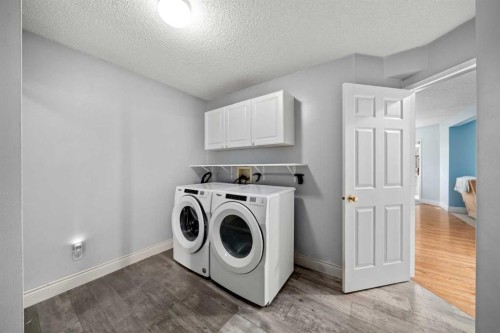 66 Crystalridge Crescent, Okotoks, AB - Indoor Photo Showing Laundry Room