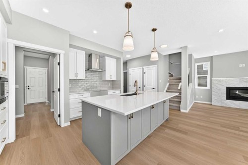 547 Mercado Avenue Se, Calgary, AB - Indoor Photo Showing Kitchen With Fireplace With Upgraded Kitchen