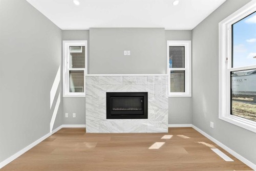547 Mercado Avenue Se, Calgary, AB - Indoor Photo Showing Living Room With Fireplace