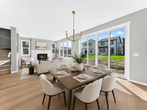 547 Mercado Avenue Se, Calgary, AB - Indoor Photo Showing Dining Room With Fireplace