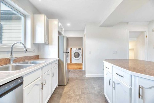 223 Coventry Road Ne, Calgary, AB - Indoor Photo Showing Kitchen With Double Sink