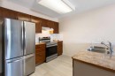 210-3 Parklane Way, Strathmore, AB  - Indoor Photo Showing Kitchen With Double Sink 