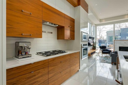 2210 Victoria Crescent Nw, Calgary, AB - Indoor Photo Showing Kitchen With Fireplace