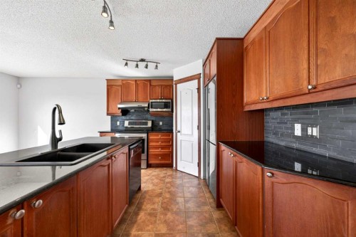 172 Kincora Drive Nw, Calgary, AB - Indoor Photo Showing Kitchen With Double Sink