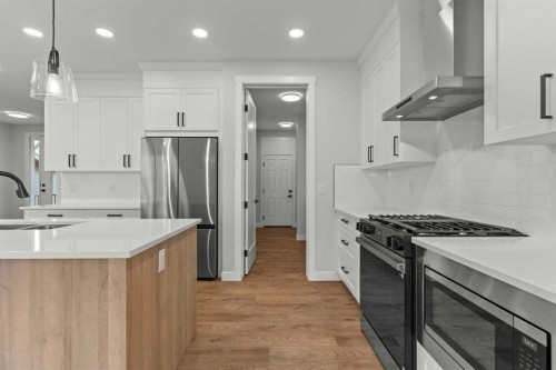 294 Kinniburgh Loop, Chestermere, AB - Indoor Photo Showing Kitchen With Stainless Steel Kitchen With Upgraded Kitchen