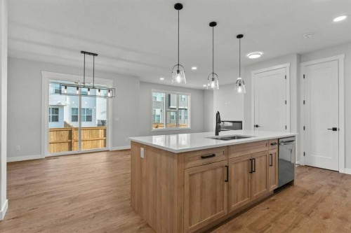 294 Kinniburgh Loop, Chestermere, AB - Indoor Photo Showing Kitchen With Double Sink