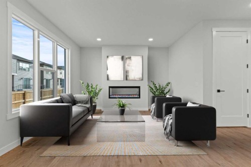 294 Kinniburgh Loop, Chestermere, AB - Indoor Photo Showing Living Room With Fireplace