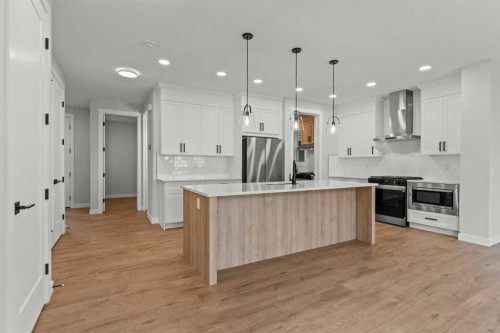 294 Kinniburgh Loop, Chestermere, AB - Indoor Photo Showing Kitchen With Upgraded Kitchen