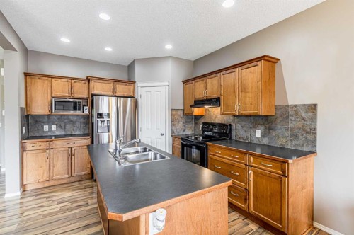 14 Elgin Meadows Way Se, Calgary, AB - Indoor Photo Showing Kitchen With Double Sink