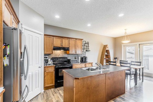 14 Elgin Meadows Way Se, Calgary, AB - Indoor Photo Showing Kitchen With Double Sink