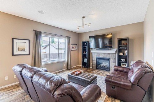 14 Elgin Meadows Way Se, Calgary, AB - Indoor Photo Showing Living Room With Fireplace