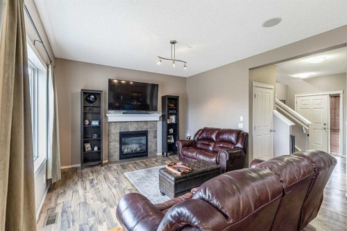 14 Elgin Meadows Way Se, Calgary, AB - Indoor Photo Showing Living Room With Fireplace