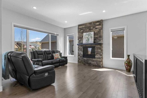112 Cranbrook View Se, Calgary, AB - Indoor Photo Showing Living Room With Fireplace
