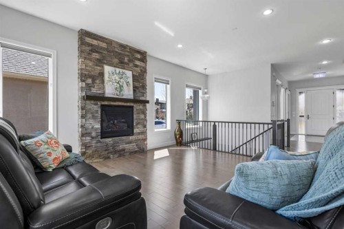 112 Cranbrook View Se, Calgary, AB - Indoor Photo Showing Living Room With Fireplace