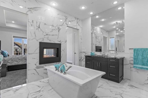 112 Cranbrook View Se, Calgary, AB - Indoor Photo Showing Bathroom With Fireplace