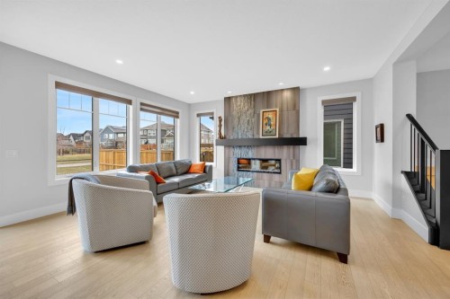 192 Magnolia Manor Se, Calgary, AB - Indoor Photo Showing Living Room With Fireplace