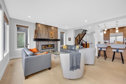 192 Magnolia Manor Se, Calgary, AB - Indoor Photo Showing Living Room With Fireplace