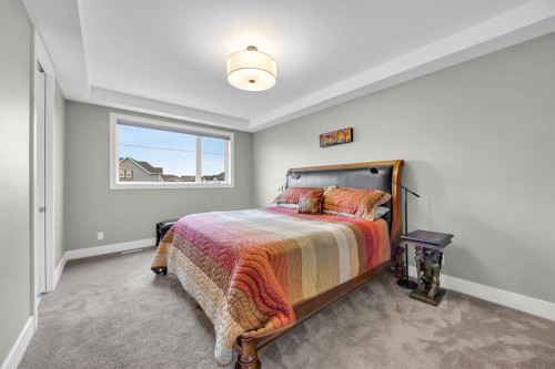 192 Magnolia Manor Se, Calgary, AB - Indoor Photo Showing Bedroom