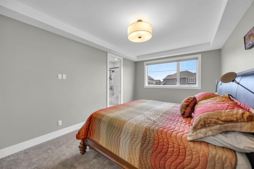 192 Magnolia Manor Se, Calgary, AB - Indoor Photo Showing Bedroom