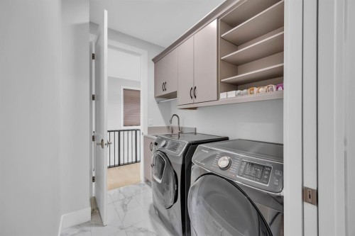 192 Magnolia Manor Se, Calgary, AB - Indoor Photo Showing Laundry Room