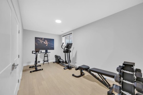 192 Magnolia Manor Se, Calgary, AB - Indoor Photo Showing Gym Room
