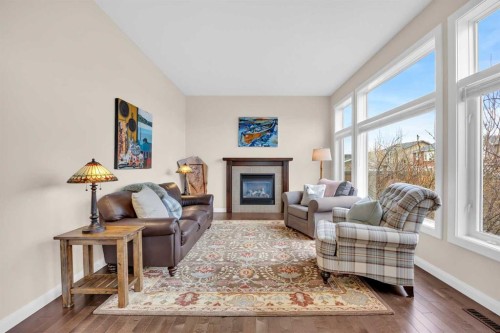 1 Westridge Way, Okotoks, AB - Indoor Photo Showing Living Room With Fireplace