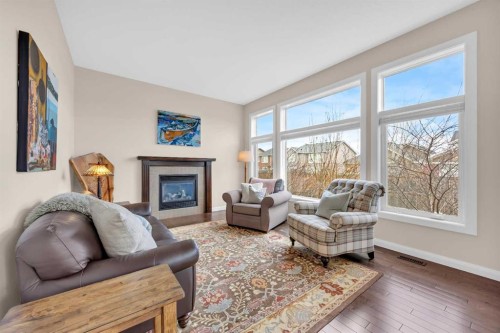 1 Westridge Way, Okotoks, AB - Indoor Photo Showing Living Room With Fireplace