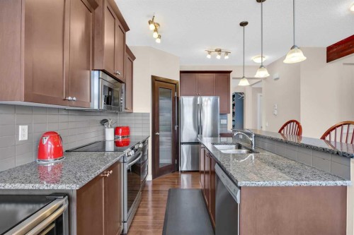 1 Westridge Way, Okotoks, AB - Indoor Photo Showing Kitchen With Double Sink With Upgraded Kitchen