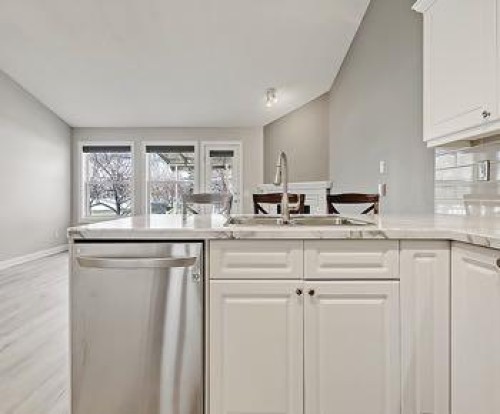 503 Marshall Rise Nw, High River, AB - Indoor Photo Showing Kitchen With Double Sink
